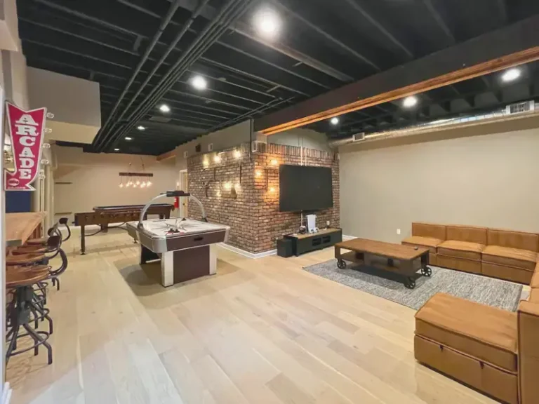 Modern game room with air hockey table and seating in West Milford, NJ.