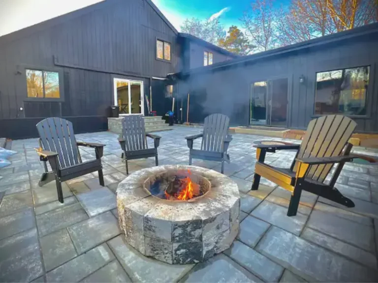 Outdoor fire pit area with Adirondack chairs in Long Pond, PA.