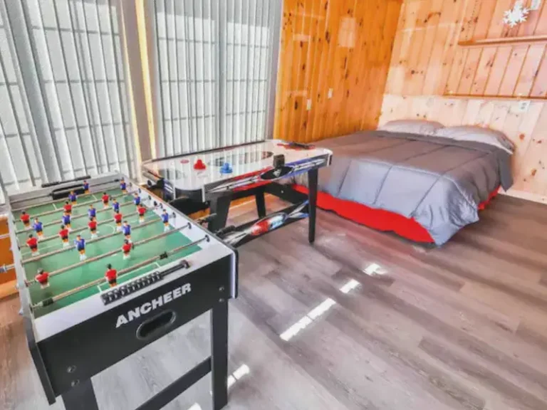 Game room with foosball and air hockey in Lanesville, NY Airbnb.
