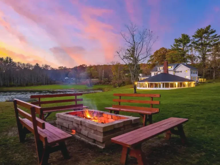 Scenic backyard with a fire pit and benches in Narrowsburg, NY Airbnb.