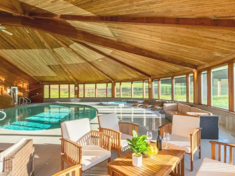 Sunlit indoor pool with wooden ceilings in Narrowsburg, NY.