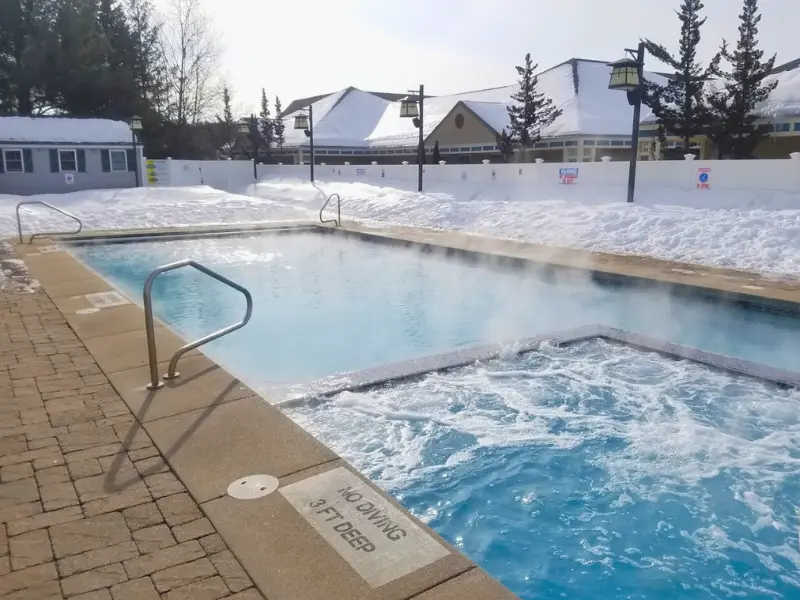 Steaming outdoor pool at North Conway Grand Hotel in winter.