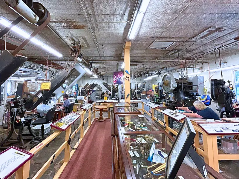 American Kazoo Company museum with vintage machines and displays.
