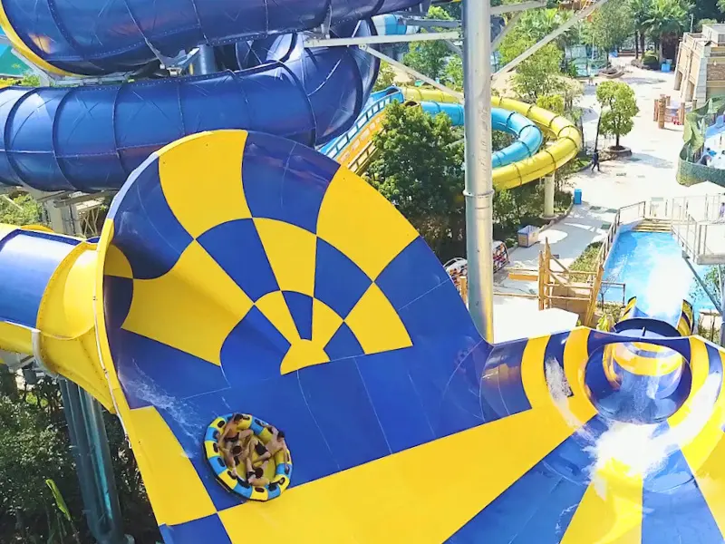 Bright yellow and blue water slide at Wicked Waves in Yarmouth, MA.