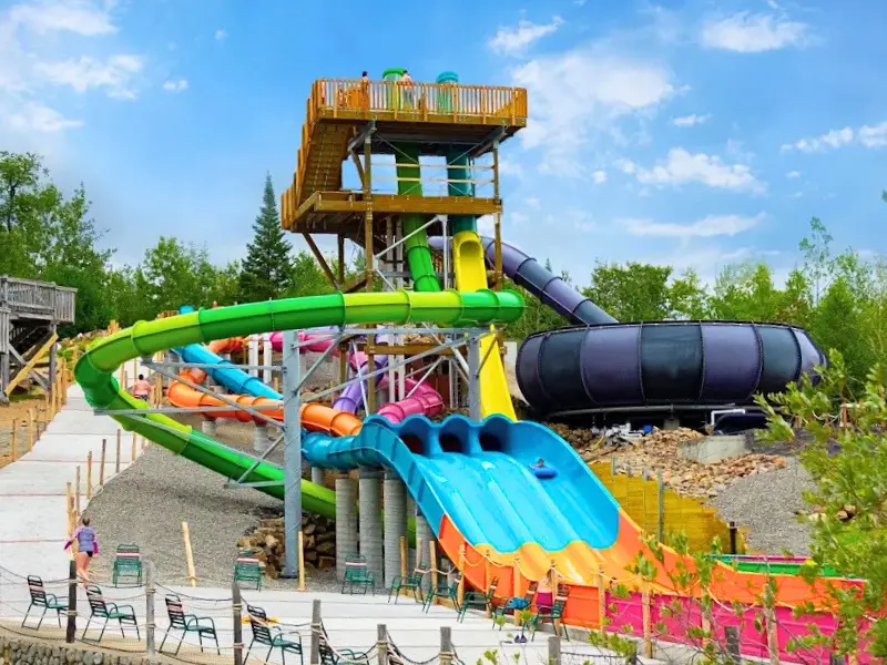 Colorful tower of twisting water slides at Enchanted Forest Water Safari in Old Forge, NY.