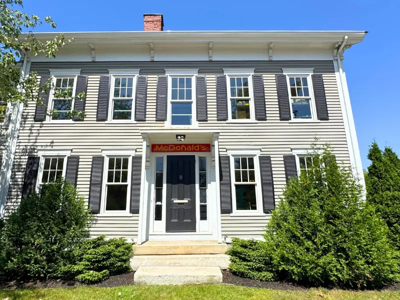 Exterior of a colonial building which happens to be a McDonalds restaurant