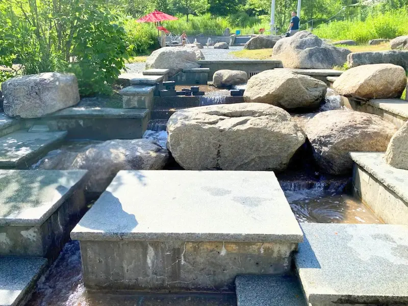 Outdoor water play area with granite channels at Montshire Museum of Science in Norwich, VT.