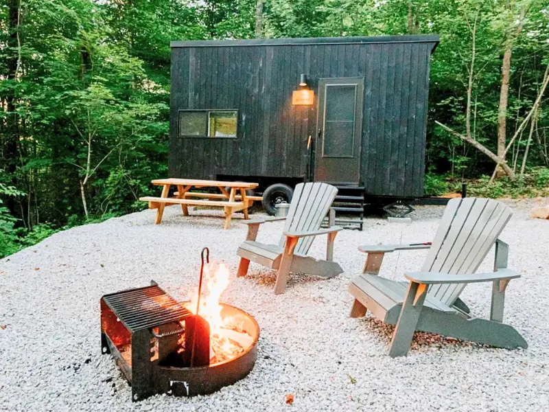 Tiny cabin with fire pit at Postcard Cabins Blake Brook NH.