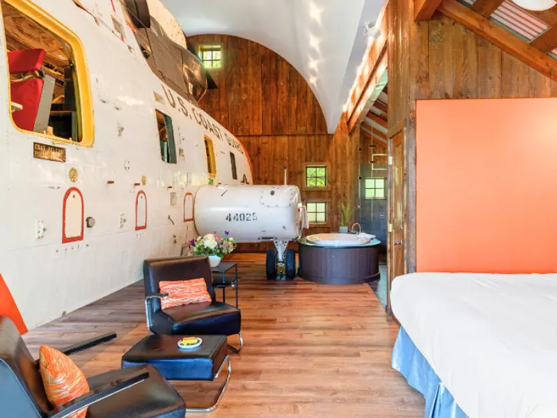 Helicopter suite inside rustic barn at a themed hotel in Connecticut.