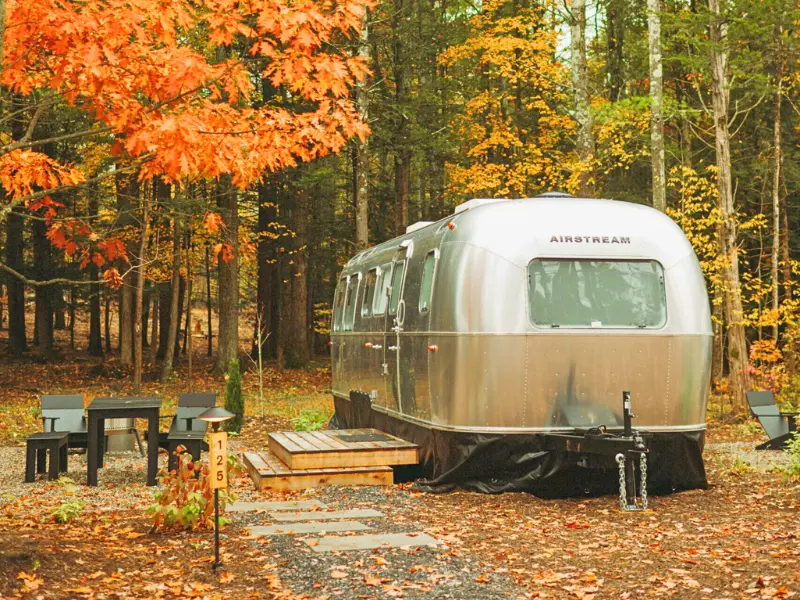 Airstream trailer at AutoCamp Catskills in fall foliage