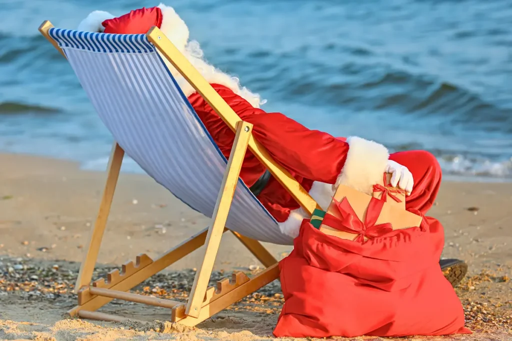 Santa relaxing by the ocean waiting for Christmas things to do in New Jersey