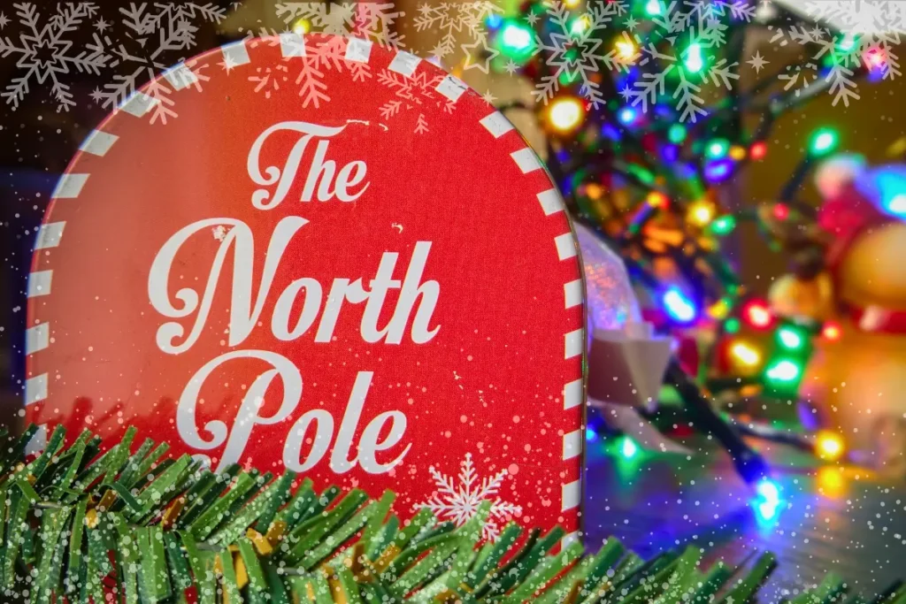 North Pole holiday sign surrounded by colorful Christmas lights