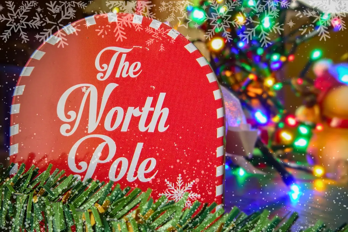 North Pole holiday sign surrounded by colorful Christmas lights