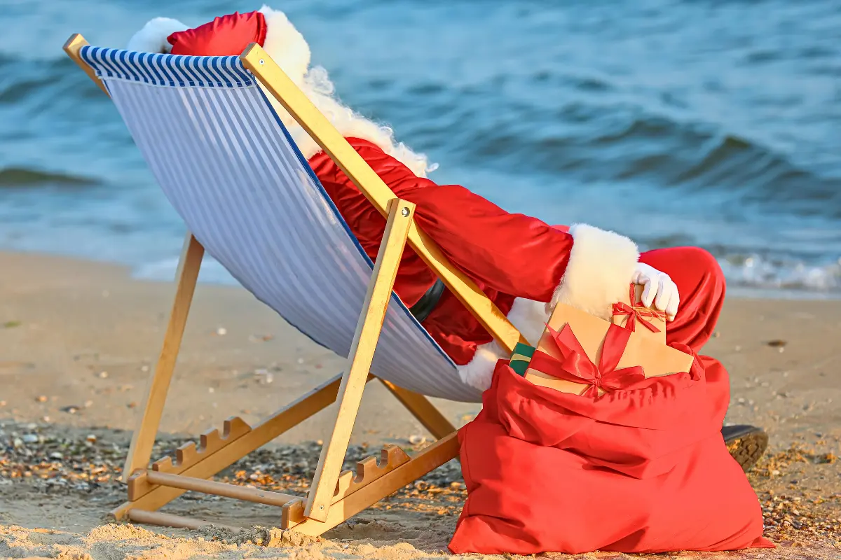 Santa relaxing by the ocean waiting for Christmas things to do in New Jersey