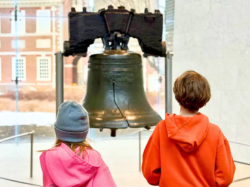 Kids viewing the Liberty Bell inside the Liberty Bell Center in Philadelphia, a historic place to take kids for free