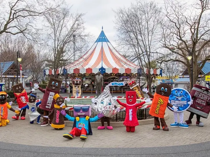Hersheypark candy characters posing in front of the carousel in Hershey, Pennsylvania
